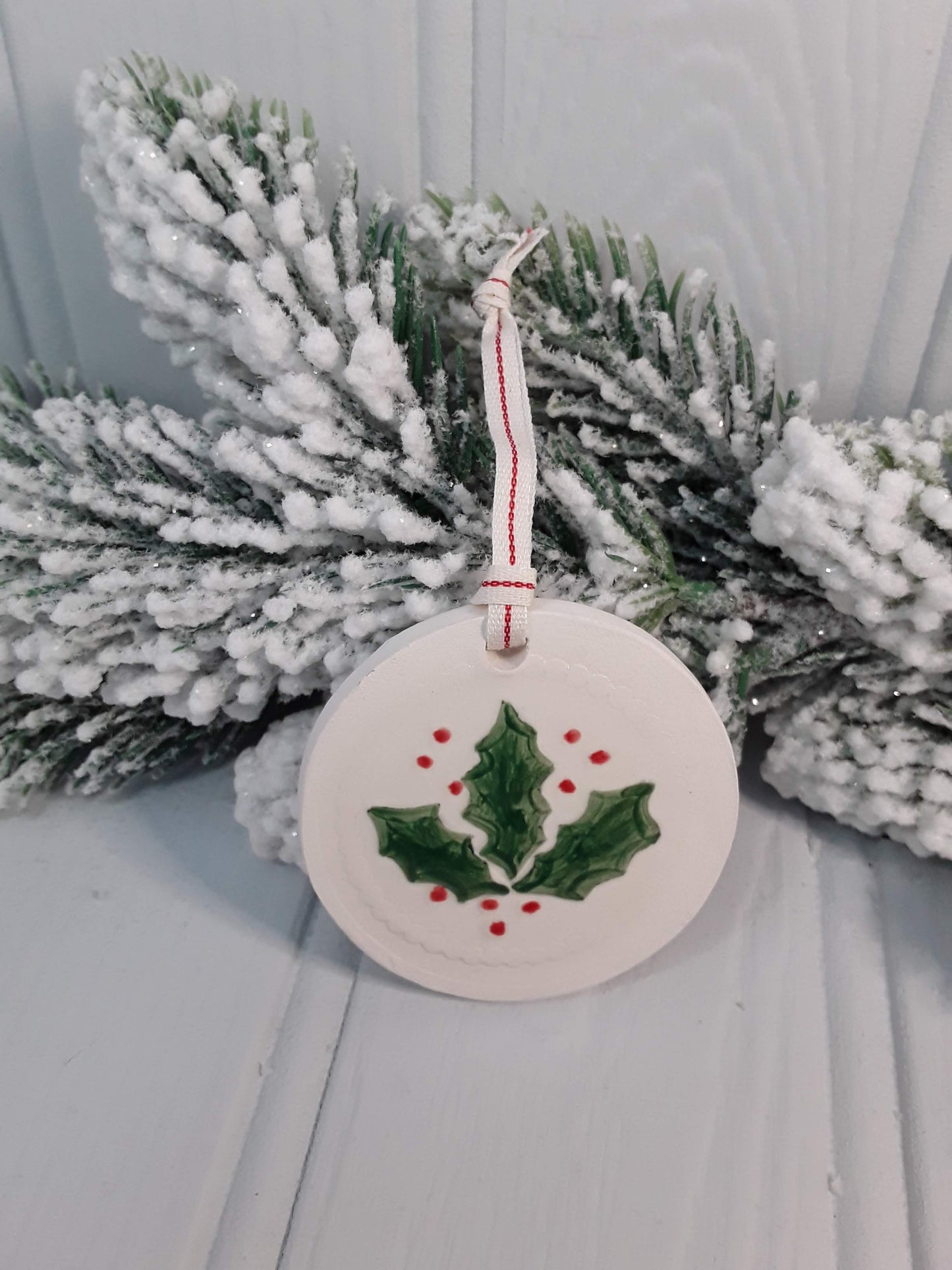 Circular Ceramic Christmas tree decoration with Holly motif