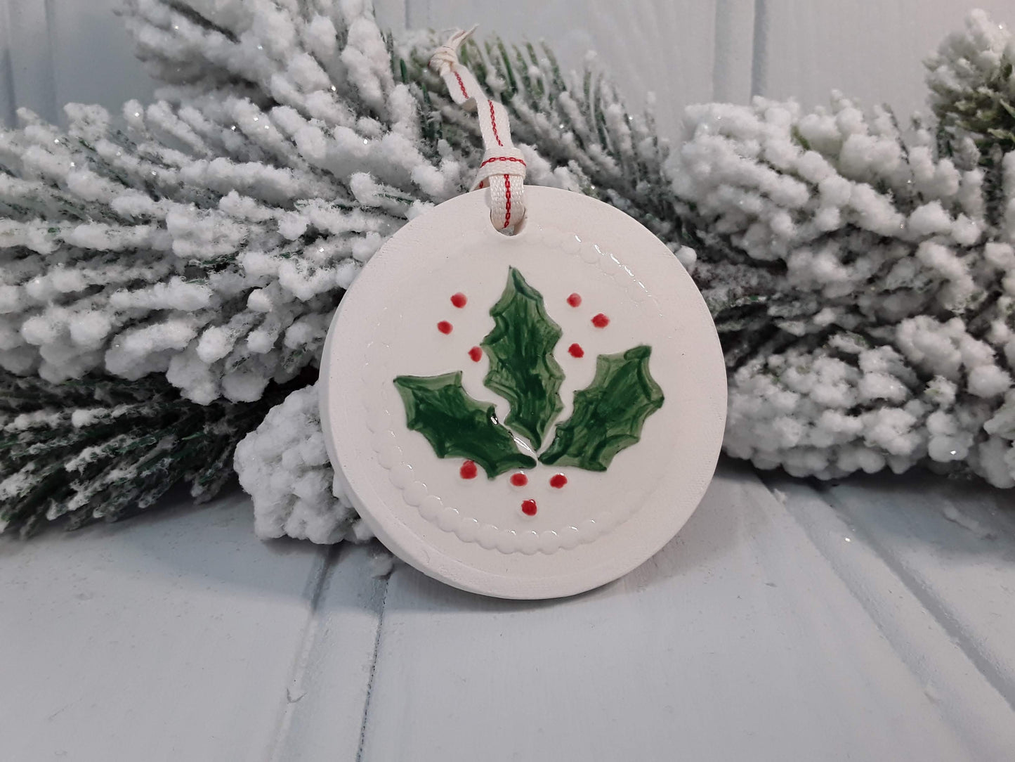 Circular Ceramic Christmas tree decoration with Holly motif