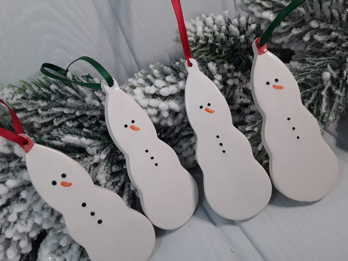 Ceramic snowmen. Handmade keepsakes. Hanging Christmas decorations