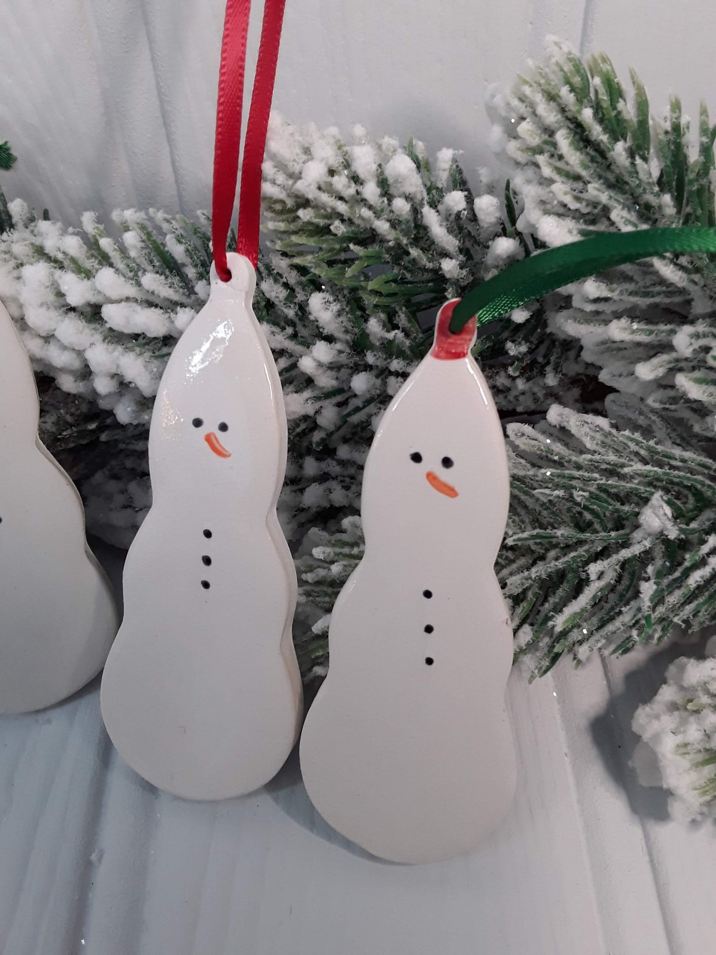 Ceramic snowmen. Handmade keepsakes. Hanging Christmas decorations