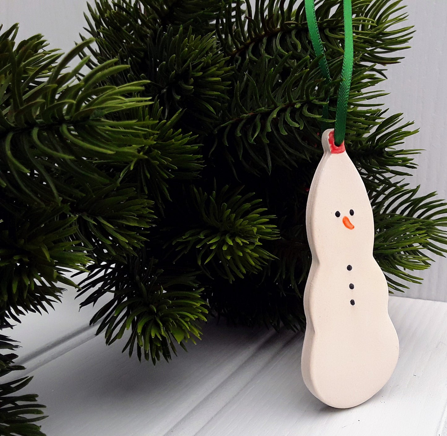 Ceramic snowman. Handmade keepsakes. Hanging Christmas decorations