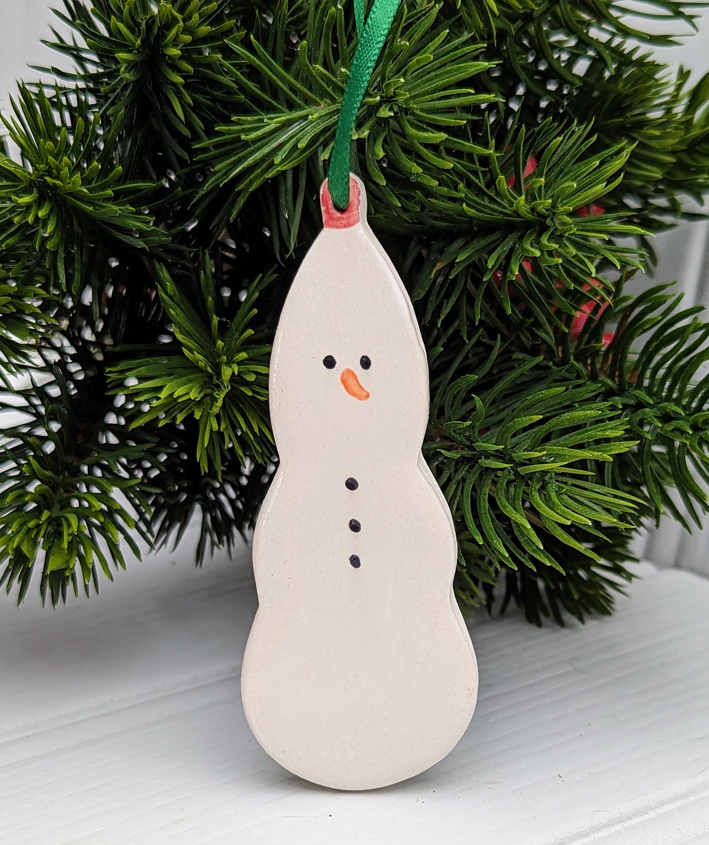 Ceramic snowman. Handmade keepsakes. Hanging Christmas decorations