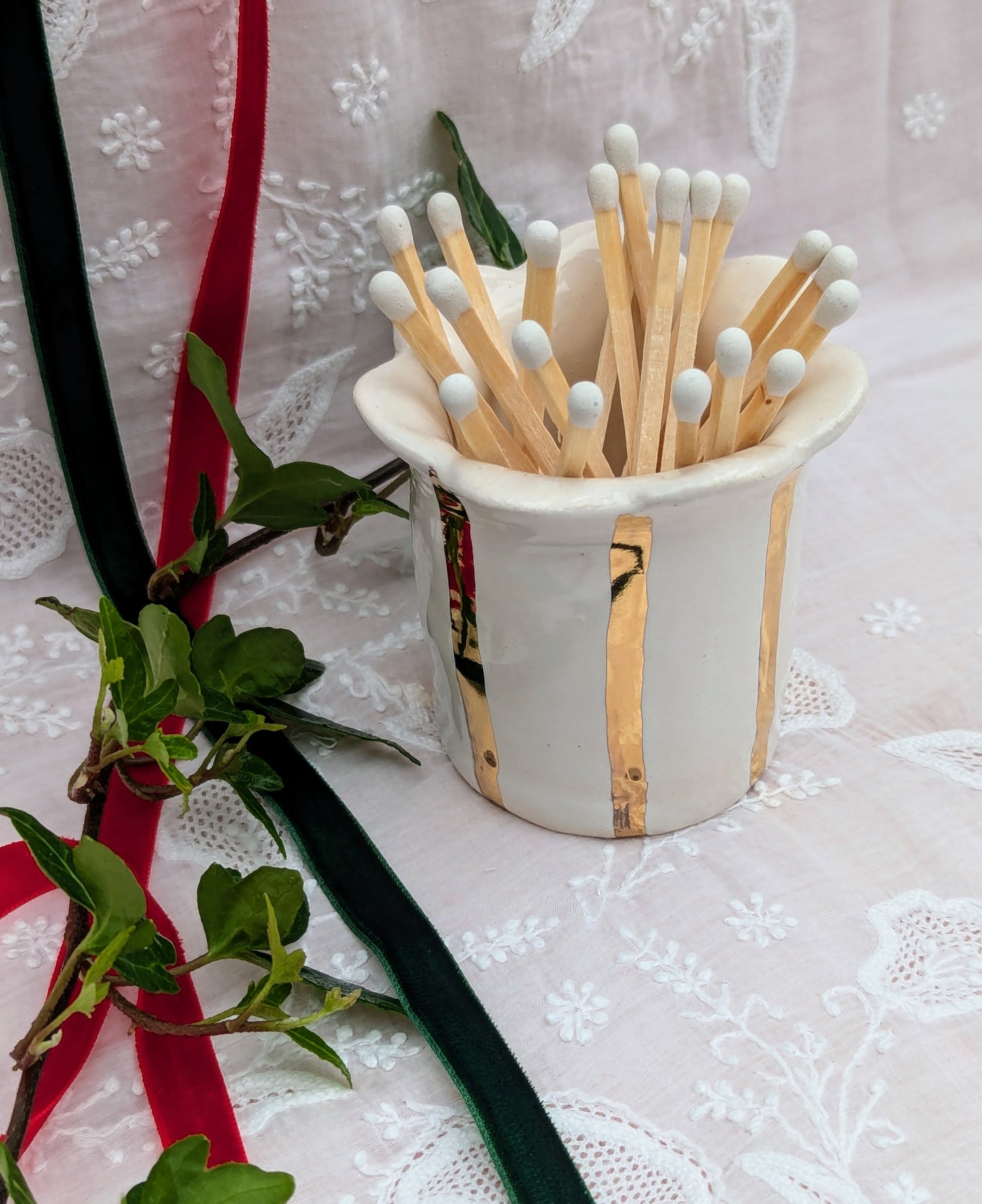 Gold striped match striker with matches. Designed and made exclusively by Sea Bramble Ceramics.