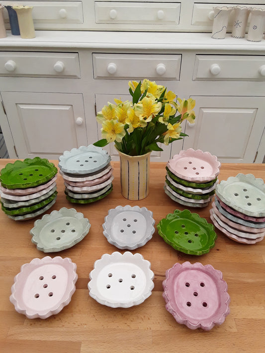 A selection of oval, scallop edged soap dishes