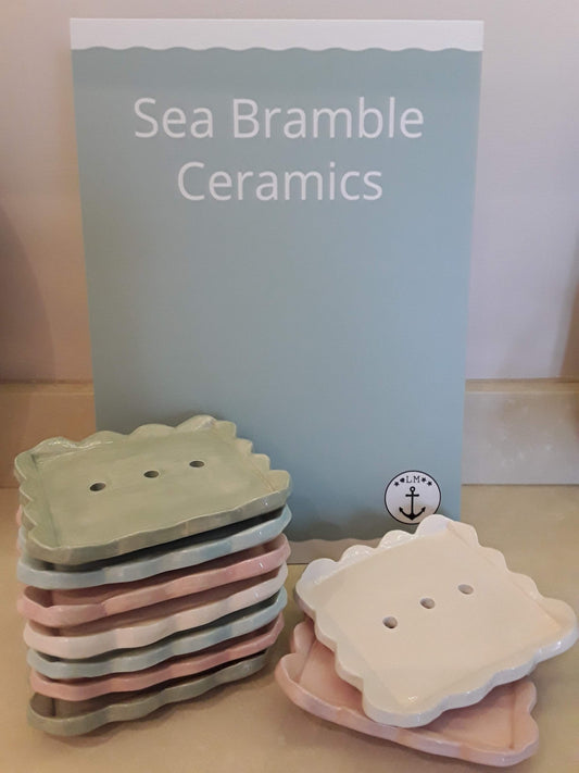A selection of rectangular scalloped edged soap dishes in various colours