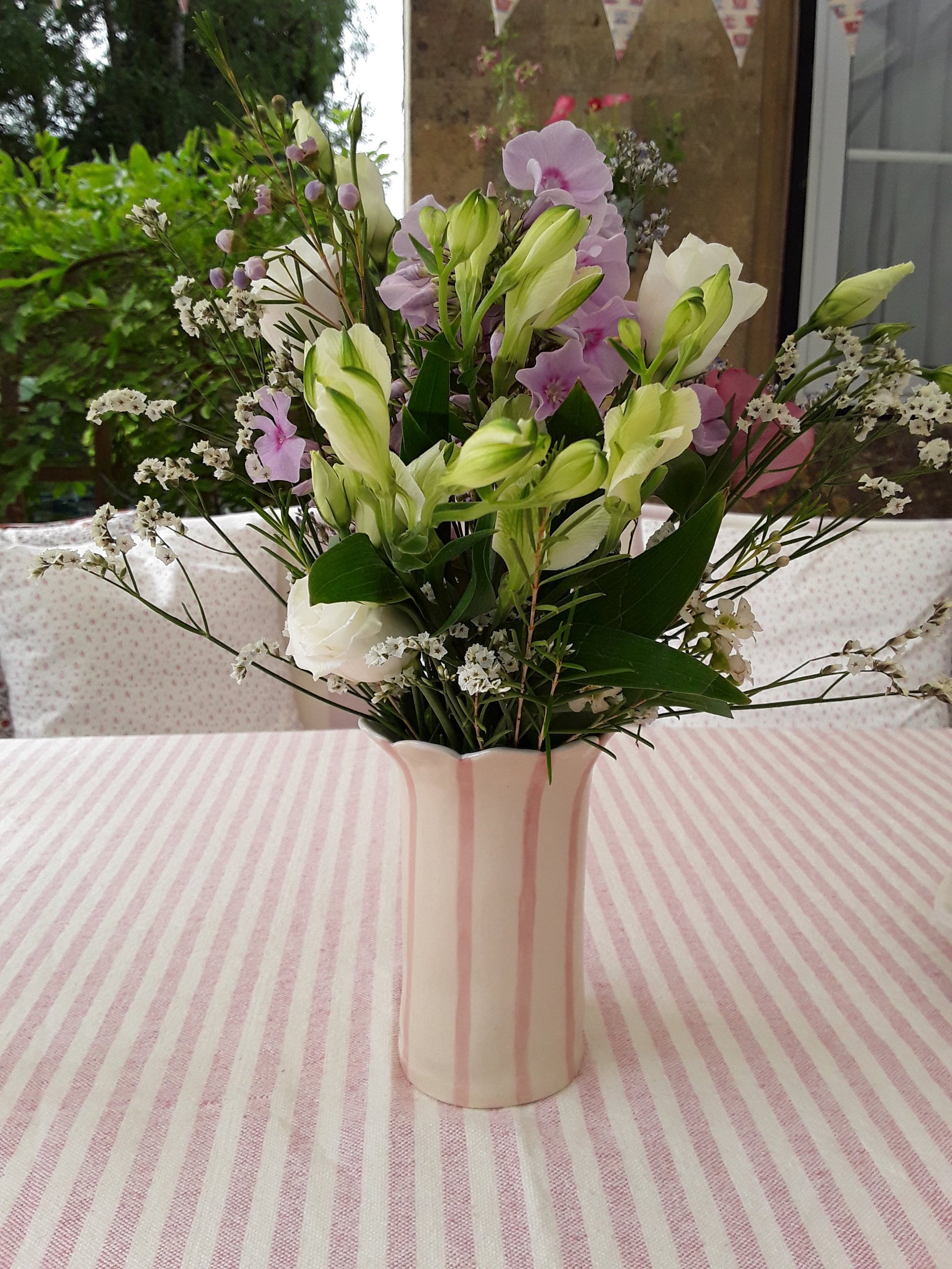 Sea Bramble Ceramics' Handmade, Stoneware Daisy vase, pink stripes and Sea Brambles' signature scalloped top.