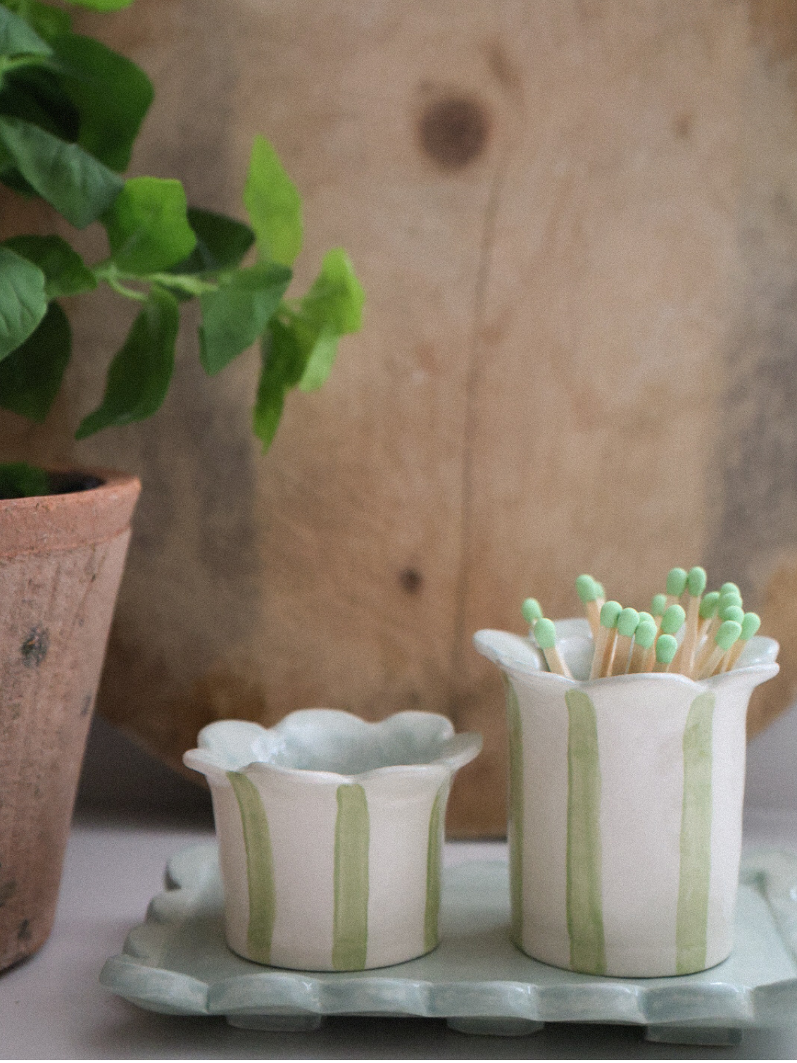 Sage striped tealight holder by Sea Bramble Ceramics with matching match striker.