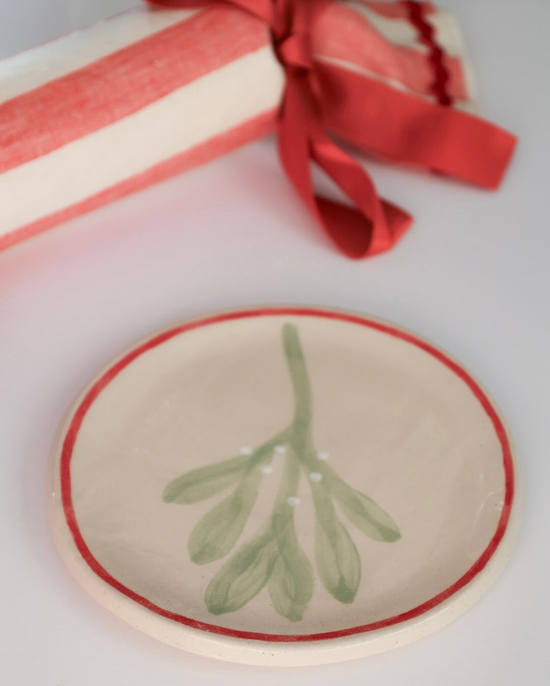 Ceramic stoneware plates with a mistletoe design. Handmade, hand-painted. Sea Bramble Ceramics. Decorative plates.