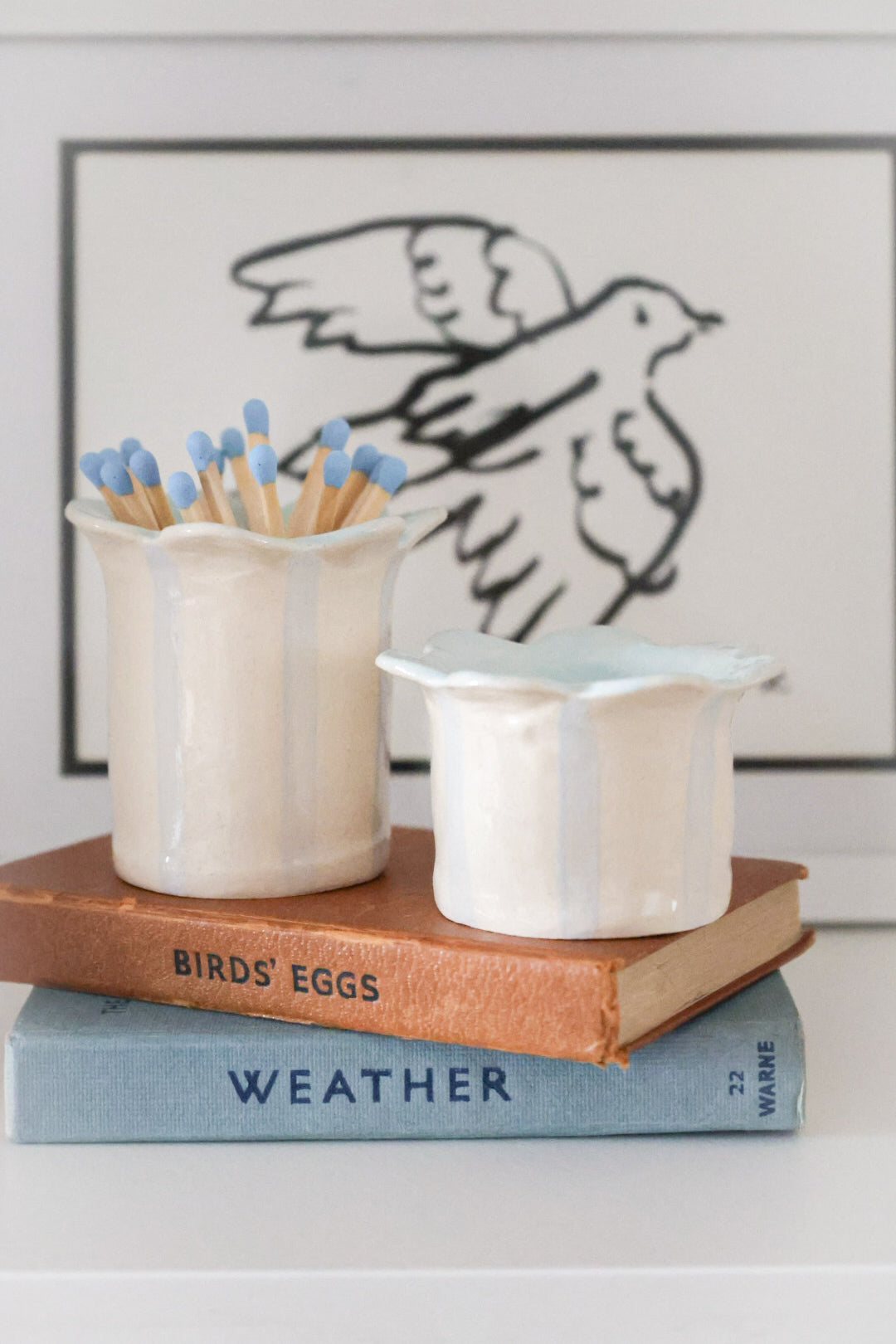 Baby blue tealight holder by sea Bramble Ceramics with a matching match striker and matches.