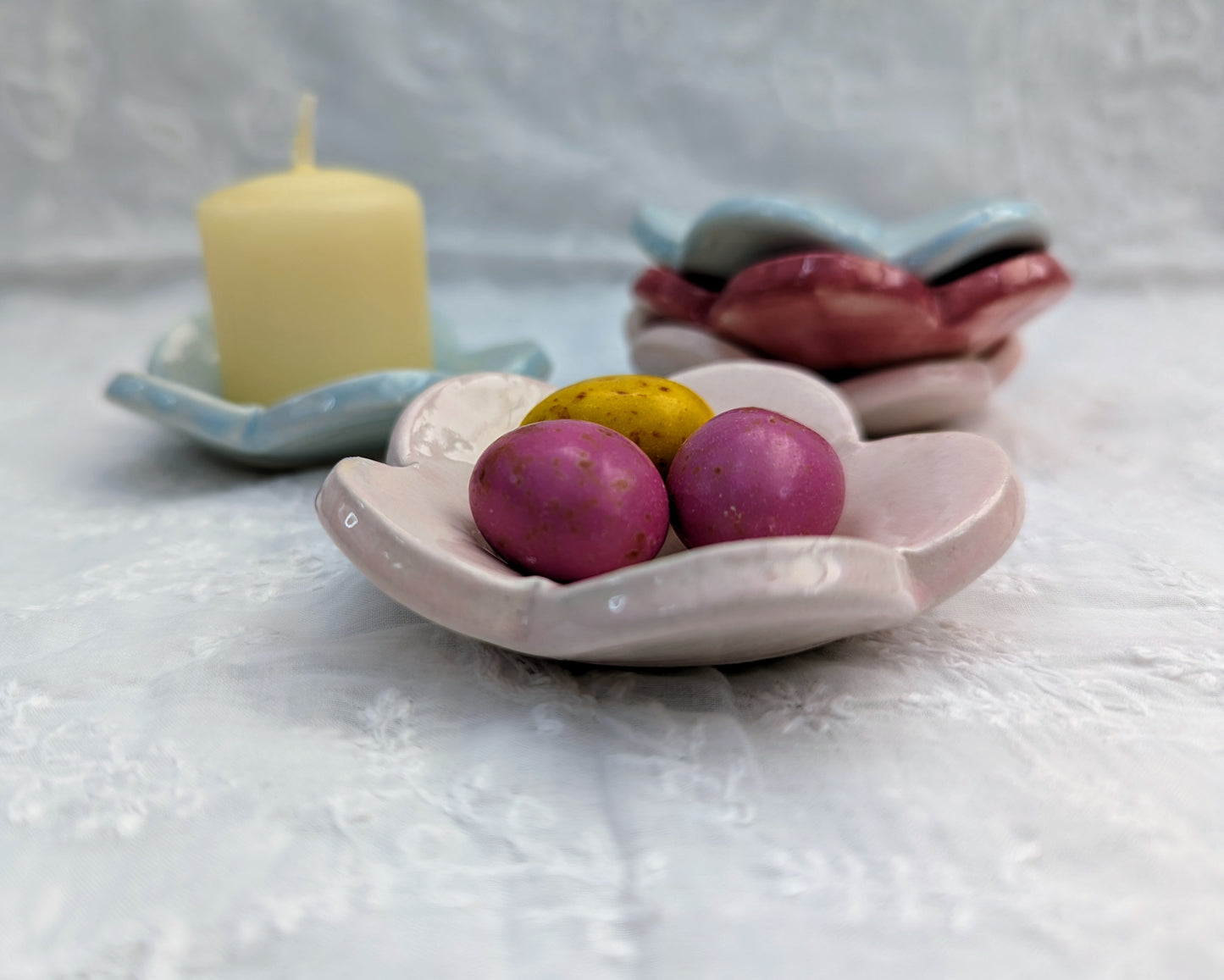 Sea Bramble Ceramics - Handmade little Flower dishes that are perfect for butter, condiments, trinkets and tealights. Shown here as a candle and a treats dish.