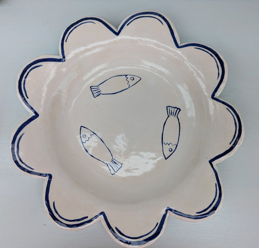Floral-patterned plate with blue fish illustrations on a white background. Designed and handmade exclusively by Sea Bramble Ceramics.